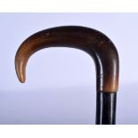 A 19TH CENTURY MIDDLE EASTERN CARVED RHINOCEROS HORN HANDLED WALKING CANE. 90 cm long.