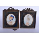 A PAIR OF EARLY 20TH CENTURY CONTINENTAL PAINTED IVORY PORTRAIT MINIATURES. Miniature 9 cm x 7 cm. (