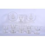 AN UNUSUAL PAIR OF GEORGE III GLASS DISHES together with six antique custard glasses. Largest 10.5 c