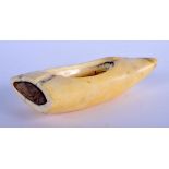 A 19TH CENTURY CONTINENTAL CARVED WHALES TOOTH BRUSH WASHER of naturalistic form. 13 cm x 6 cm.