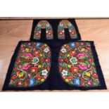 A metal thread and fabric embroider panel with a colourful display of flowers together with another