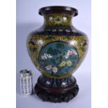 A LARGE LATE 19TH CENTURY CHINESE CLOISONNE ENAMEL BALUSTER VASE decorated with foliage and vines. C
