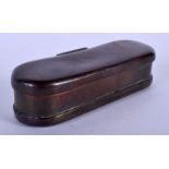 AN EARLY 18TH CENTURY EUROPEAN OVAL FORMED BRONZE TOBACCO BOX decorated in a naive manner with engra