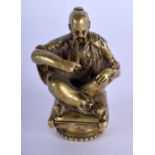 A GEORGE III BRONZE FIGURE OF A SEATED CHINAMAN modelled smoking opium. 6.5 cm x 3 cm.