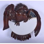 A CHARMING 19TH CENTURY BLACK FOREST CARVED WOOD MIRROR modelled as an eagle clutching a crescent sh
