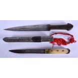 A RARE 19TH CENTURY MIDDLE EASTERN RHINOCEROS HORN HANDLED DAGGER together with another similar knif