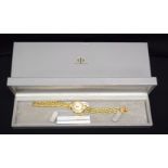 A BOXED 18CT GOLD BAUME & MERCIER DIAMOND WRISTWATCH with 18ct gold strap. 46 grams. 17 cm long, dia