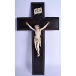 A 19TH CENTURY EUROPEAN CARVED IVORY CORPUS CHRISTI modelled upon a carved wood cross. 48 cm x 24 cm