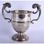 AN ANTIQUE TWIN HANDLED SILVER TROPHY. Sheffield 1904. 1026 grams. 29 cm x 28 cm.