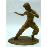 A contemporary metal figure of Bruce Lee 35 x 30 cm