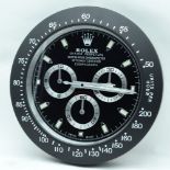 A contemporary Rolex type wall clock 34cm.