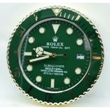 A contemporary Rolex type wall clock 34cm.