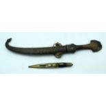 A middle Eastern wooden handled dagger with a copper sheave together with a smaller knife. 39cm.