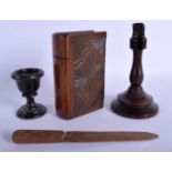 A RARE ANTIQUE TREEN CARVED WOODEN HIDDEN BOOK MONEY BOX together with three other items. Largest 13
