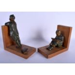 A PAIR OF EARLY 20TH CENTURY FRENCH BRONZE FIGURAL BOOKENDS modelled upon wooden plinths. 24 cm x 19