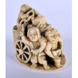 A FINE 19TH CENTURY JAPANESE MEIJI PERIOD CARVED IVORY OKIMONO modelled as numerous figures upon a c