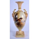 Royal Worcester fine and rare two handled vase painted with a goldfinch by E. Baker, signed, date ma