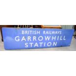 A large enamelled metal British railways sign of Garrowhill station. 246 x 72 cm