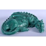 AN UNUSUAL ART DECO WELSH MAJOLICA TYPE POTTERY FIGURE OF A DRAGON modelled reclining. 22 cm x 22 cm