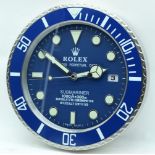 A contemporary Rolex type wall clock 34cm.