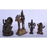 FOUR 19TH CENTURY INDIAN BRONZE FIGURES OF DEITIES modelled in various forms. Largest 18 cm high. (4