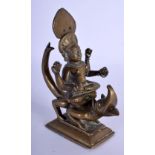 AN 18TH CENTURY INDIAN BUDDHISTIC BRONZE FIGURE OF A DEITY modelled riding upon a beast. 11 cm x 13