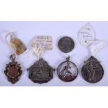 FOUR UNUSUAL ANTIQUE SILVER MEDALLIONS together with an American quarter. (5)