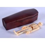 A CONTEMPORARY CARVED BONE AND WOOD COFFIN. 14 cm long.