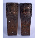 A PAIR OF 18TH CENTURY CARVED OAK WALL PLAQUE BRACKETS one with polychromed decoration. 25 cm x 7 cm