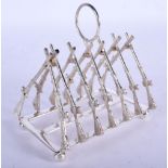 A SILVER GUN TOAST RACK. 11 cm x 11 cm.