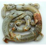 A carved Chinese hardstone boulder in the form of a dragon 9 x 9 cm .