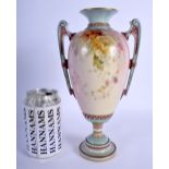 A 19TH CENTURY ROYAL WORCESTER TWIN HANDLED VASE C1894 painted with flowers. 26 cm high.