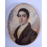 A MID 19TH CENTURY EUROPEAN PAINTED IVORY PORTRAIT MINIATURE depicting a handsome male wearing a bro