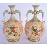 Royal Worcester pair of two handled blush ivory vases painted with thistles and flowers in the manne