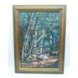 A framed Oil on canvas of a forest scene 54 x 37cm.