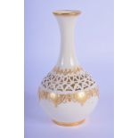 A FINE ROYAL WORCESTER RETICULATED PORCELAIN VASE by George Owen, painted with scrolling foliage and