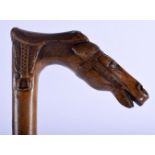 AN 18TH CENTURY EUROPEAN FRUITWOOD HORSE HEAD WALKING CANE. 90 cm long.