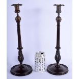 A PAIR OF GEORGE III CAST TOP CARVED WOOD CANDLESTICKS. 40 cm high.