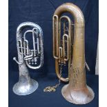 A brass Tuba together another with a smaller American Standard Tuba (2)