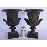 A PAIR OF CONTEMPORARY EUROPEAN TWIN HANDLED BRONZE VASES After the Antiquity. 34 cm x 18 cm.
