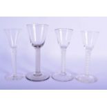 THREE GEORGE III SPIRAL TWIST GLASSES together with an Edwardian glass, three with opaque twists. La
