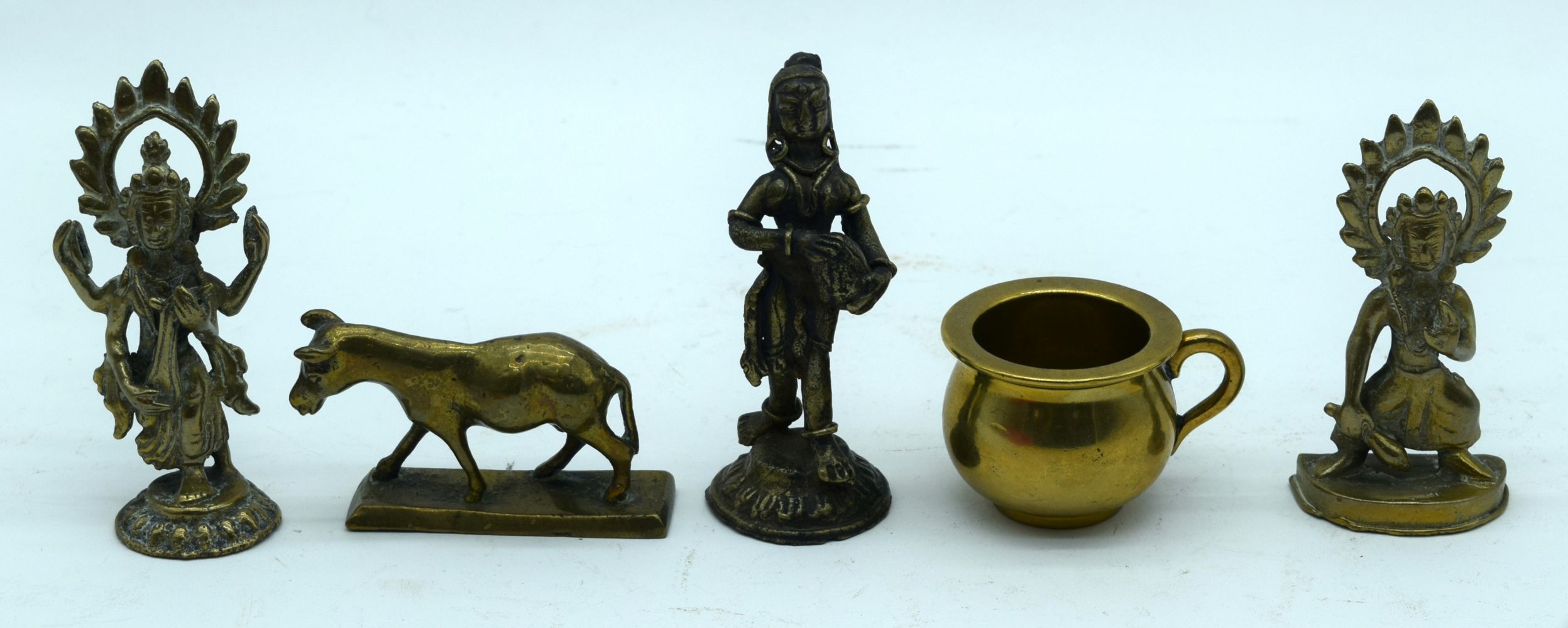 A small bronze Indian dancing figure together with Tibetan brass figures etc 9cm (5).