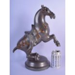 AN UNUSUAL LARGE EARLY 20TH CENTURY CHINESE PEWTER HORSE modelled upon a circular plinth. 41 cm x 24