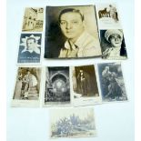 An autographed photograph of Rudolph Valentino together with photographic postcards of Valentino 25