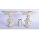 A PAIR OF 19TH CENTURY EUROPEAN GRAND TOUR CARVED ALABASTER VASES upon lozenge form bases. 25 cm x 2