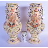 A LARGE PAIR OF EARLY 20TH CENTURY JAPANESE MEIJI PERIOD TWIN HANDLED VASES enamelled with flowers a