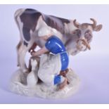 A ROYAL COPENHAGEN PORCELAIN FIGURE OF A MILK MAID. 18 cm x 18 cm.