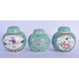 THREE CHINESE REPUBLICAN PERIOD FAMILLE ROSE GINGER JARS AND COVERS painted with figures and birds.