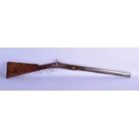 A 19TH CENTURY ENGLISH PERCUSSION CAP RIFLE with engraved barrel. 100 cm long.