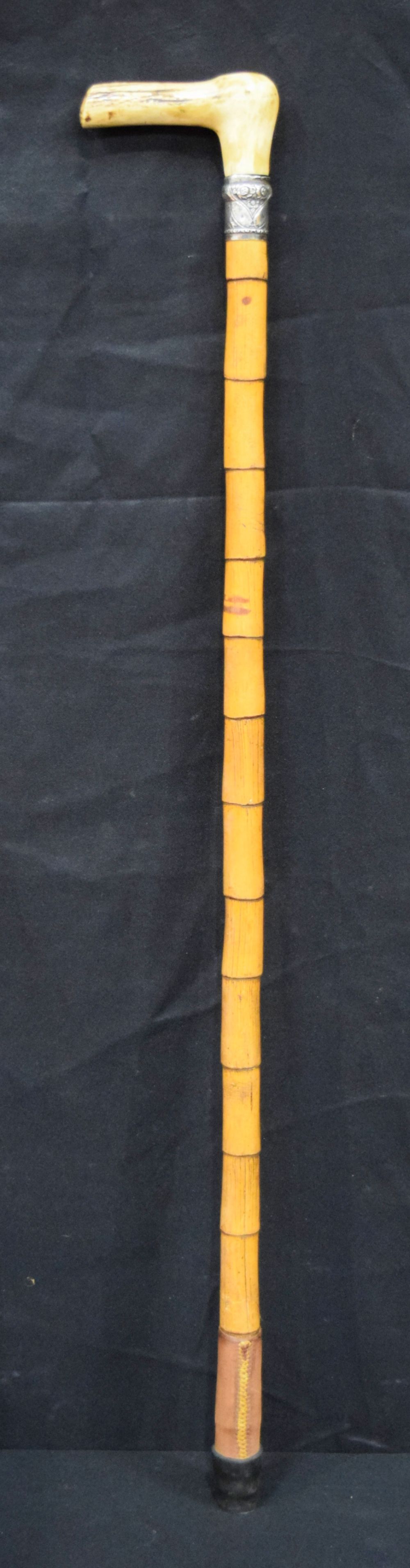 A measuring stick and spirit level bamboo walking cane with a silver collar and Antler handle 92cm .